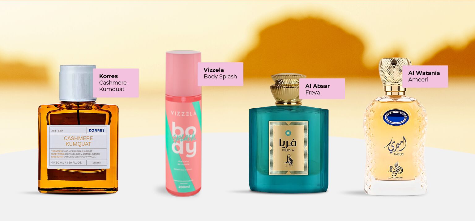 Frascos de perfumes e body splash sobre fundo suave